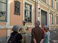 Chuck telling Joyce, Ronnie, Baiba, and Carolyn<br />about Peter the Great's stay in Riga in this building<br />(Peter Palace on Palasta Street).<br />June 3, 2011 - Riga, Latvia.