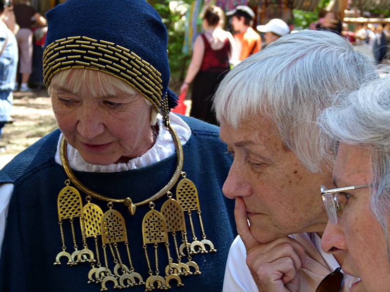 Baiba and Joyce examining this artist's jewelry.<br />Arts and crafts fair at the Latvian Ethnographic Open Air Museum.<br />June 4, 2011 - Riga, Latvia.