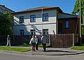 House build by Uncle Herberts and now occupied by this grandsons.<br />The house is on a portion of property that my uncles owned.<br />Daina is heading into the house to introduce us to one of the sons<br />while Baiba, Joyce, and Ronnie look on.<br />June 4, 2011 - Riga, Latvia.