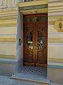 Door to the Hungarian Embassy on Alberta Street.<br />Reflection of Betsy in the glass.<br />June 5, 2011 - Riga, Latvia.