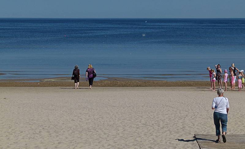 Joyce and Linda heading to wade in the Baltic Sea while Baiba is not far behind.<br />June 6, 2011 - Majori, Jurmala, Latvia.