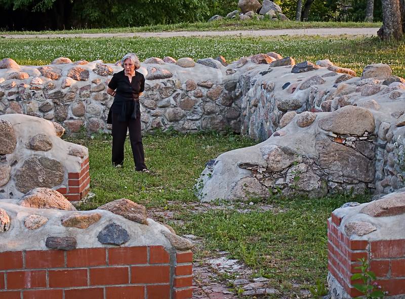 Joyce inspecting the nearby ruins.<br />June 9, 2011 - At Annas Resort, Zaubes pagasts (parish), Latvia.