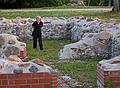 Joyce inspecting the nearby ruins.<br />June 9, 2011 - At Annas Resort, Zaubes pagasts (parish), Latvia.