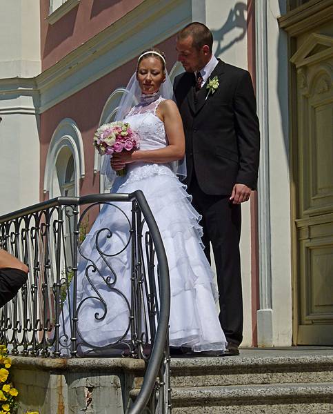 Newly wed couple posing for a photograph.<br />Birinu Palace grounds.<br />June 11, 2011 - Birini, Latvia.