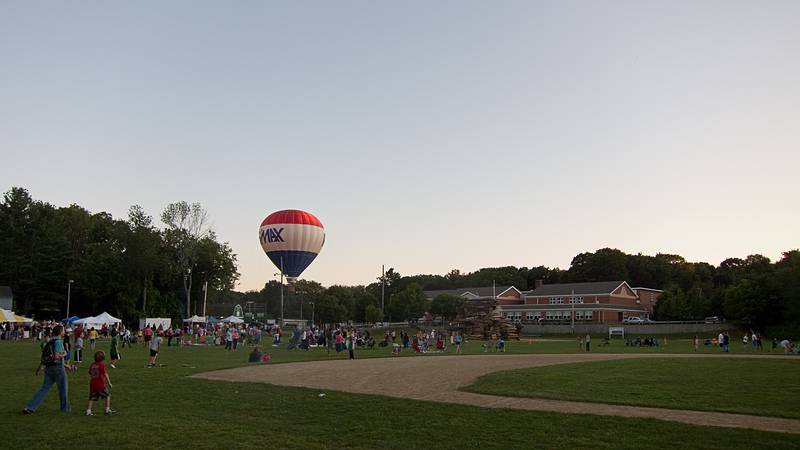 Tethered hot air balloon rides.<br />Old Home Days bonfire evening.<br />August 12, 2011 - Athletic field in front of the Donahue School, Merrimac, Massachusetts.