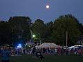 The full moon rises over the fair.<br />Old Home Days bonfire evening.<br />August 12, 2011 - Athletic field in front of the Donahue School, Merrimac, Massachusetts.