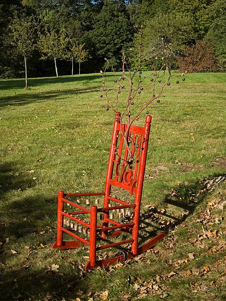 Bettina Turner: 'Lucy's Chair', child's rocking chair, brass bells, branch, beads, wire.<br />'Play', Outdoor Sculpture at Maudslay.<br />Sept. 10, 2011 - Maudslay State Park, Newburyport, Massachusetts.