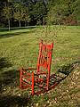 Bettina Turner: 'Lucy's Chair', child's rocking chair, brass bells, branch, beads, wire.<br />'Play', Outdoor Sculpture at Maudslay.<br />Sept. 10, 2011 - Maudslay State Park, Newburyport, Massachusetts.