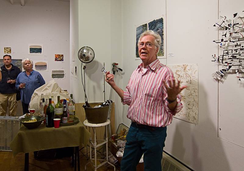 Conley welcoming people to the show opening reception.<br />Watercolor exhibit at Conley Harris' studio.<br />Sept. 22, 2011 - Boston, Massachusetts.