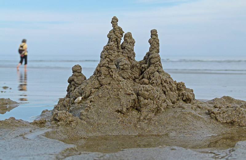 Sand castle with Joyce in the background.<br />Sept. 25, 2011 - Parker River National Wildlife Refuge, Plum Island, Massachusetts.