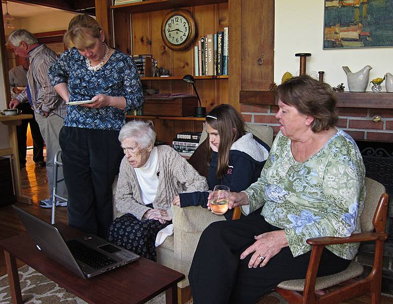John in back, Iveta, Mirdza, Melisa, and Helga watching photos on a laptop.<br />Oct. 16, 2011 - At Uldis and Edite's in Manchester by the Sea, Massachusetts.