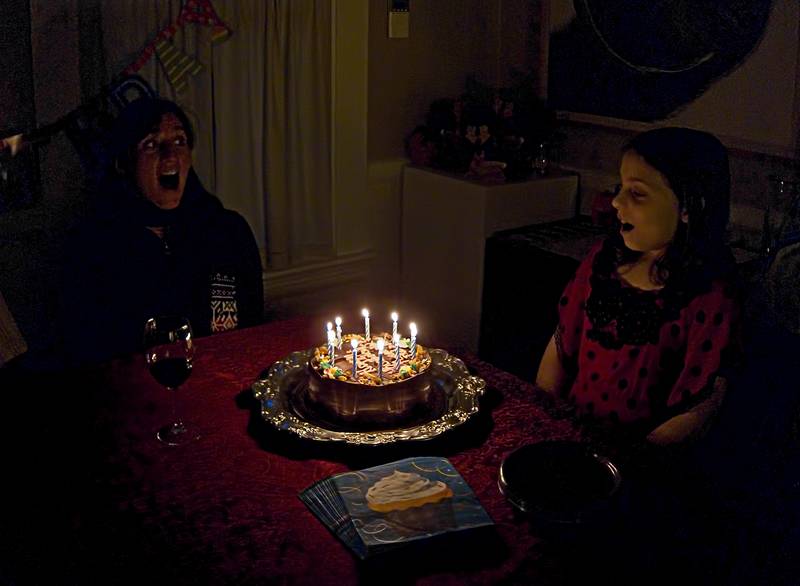 Melody and Miranda about to blow out the candles.<br />Miranda's birthday and celebrating Melody's birthday also.<br />Dec. 26, 2011 - Merrimac, Massachusetts.