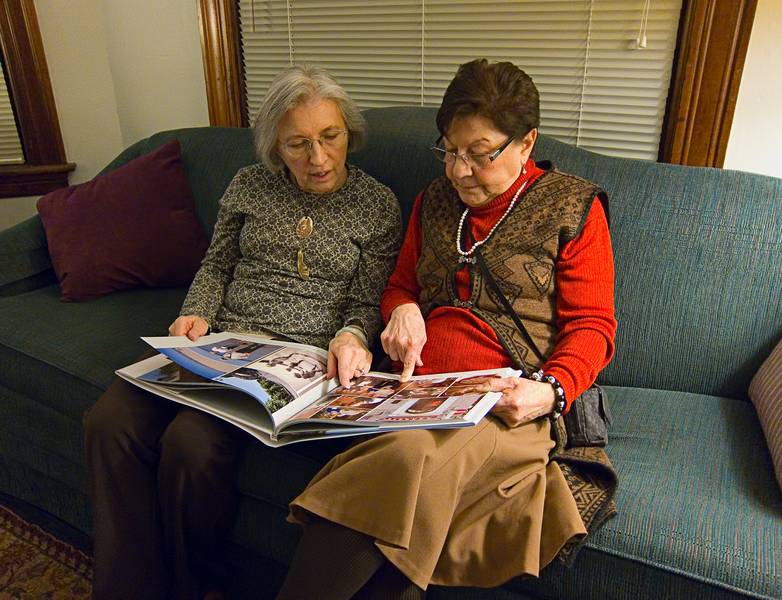 Joyce and Ana looking at Baiba's book of our travels in Latvia.<br />Miranda's birthday and celebrating Melody's birthday also.<br />Dec. 26, 2011 - Merrimac, Massachusetts.