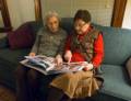 Joyce and Ana looking at Baiba's book of our travels in Latvia.<br />Miranda's birthday and celebrating Melody's birthday also.<br />Dec. 26, 2011 - Merrimac, Massachusetts.
