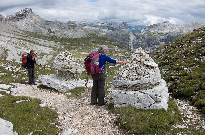 Melody photographing Joyce adding a stone to the cairn.<br />Hike from Seceda cable car terminal to Puez hut.<br />July 26, 2011 - NE of St. Ulrich/Ortisei, Italy.