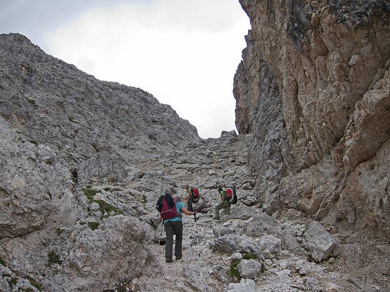 Joyce, Melody, and Sati heading for Marcuoira notch.<br />It was steep and footing was difficult in this section.<br />Hike from cable car terminal at Rifugio Faloria to Rifugio Vandelli near Lake Sorapiss.<br />July 29, 2011 - East of Cortina d' Ampezzo, Italy.