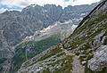 The scenery is so spectacular I am being left behind taking photos.<br />Hike from cable car terminal at Rifugio Faloria to Rifugio Vandelli near Lake Sorapiss.<br />July 29, 2011 - East of Cortina d' Ampezzo, Italy.