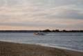 Lobster boat heading up the Merrimack River.<br />Jan. 1, 2010 - North end of Plum Island, Massachusetts.