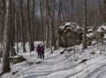Nancy and Joyce next to an erratic.<br />Along the Brown Ash Swamp Bike Trail.<br />Feb. 19, 2012 - Waterville Valley, New Hampshire.