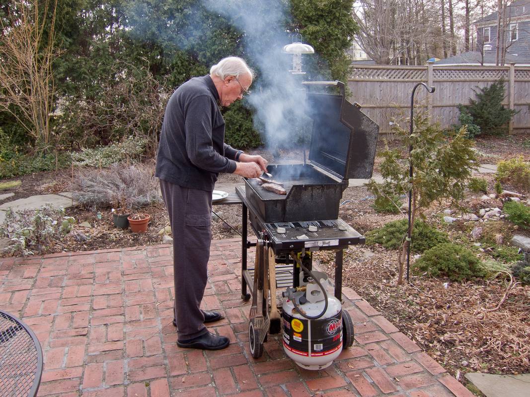 John grilling some steaks.<br />March 12, 2012 - Newburyport, Massachusetts.