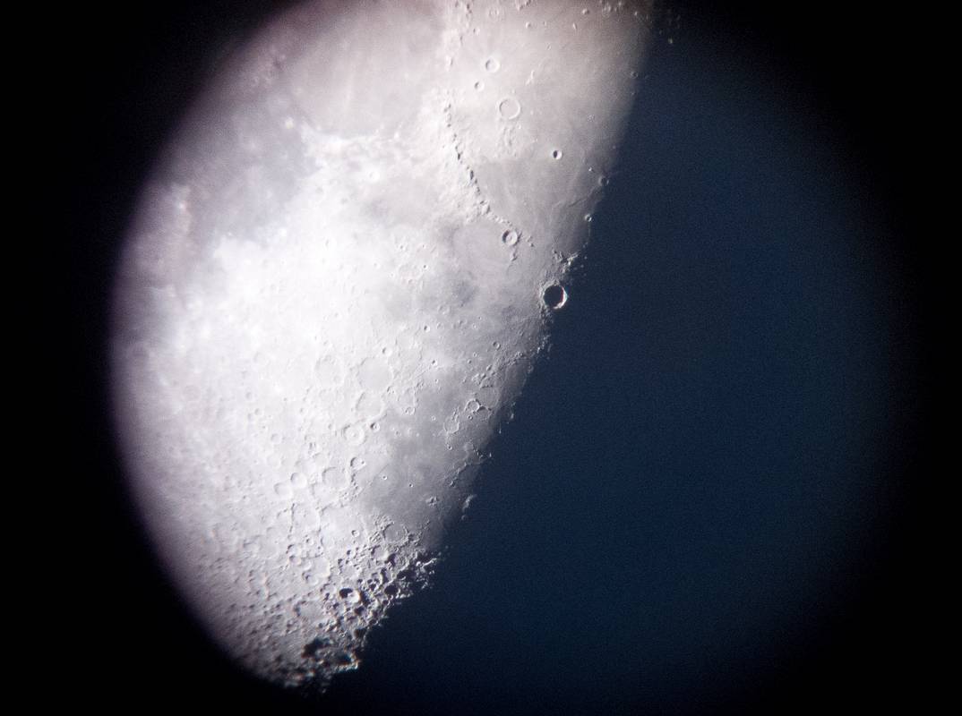 Amateur astronomers set up some scopes on the sidewalk.<br />I shot this through the eyepiece of one of them.<br />March 31, 2012 - Portsmouth, New Hampshire.