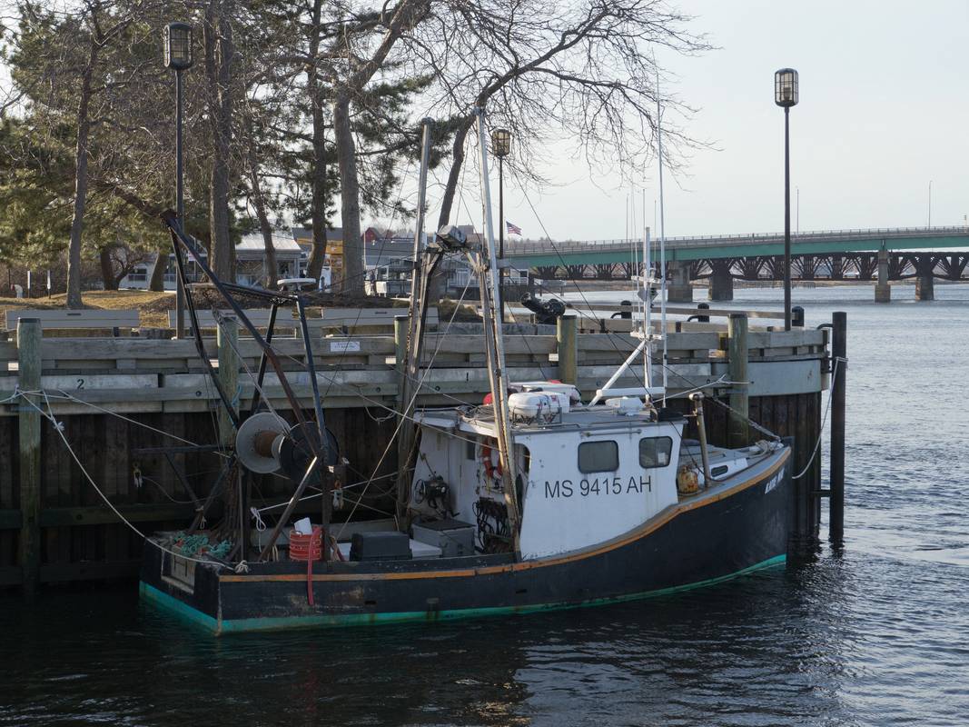 Fishing boat docked along the boardwalk..<br />March 8, 2012 - Newburyport, Massachusetts.