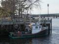 Fishing boat docked along the boardwalk..<br />March 8, 2012 - Newburyport, Massachusetts.