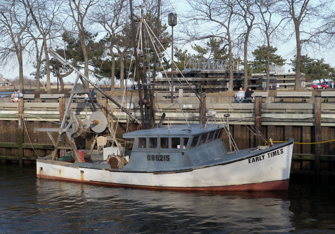 Fishing boat docked along the boardwalk..<br />March 8, 2012 - Newburyport, Massachusetts.