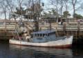 Fishing boat docked along the boardwalk..<br />March 8, 2012 - Newburyport, Massachusetts.