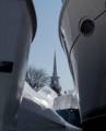 Spire of the Central Congregational Church seen between boats<br />at Hilton's Boat Yard.<br />March 20, 2012 - Newburyport, Massachusetts.