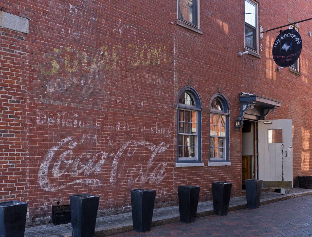 Fading sign off State Street.<br />March 20, 2012 - Newburyport, Massachusetts.