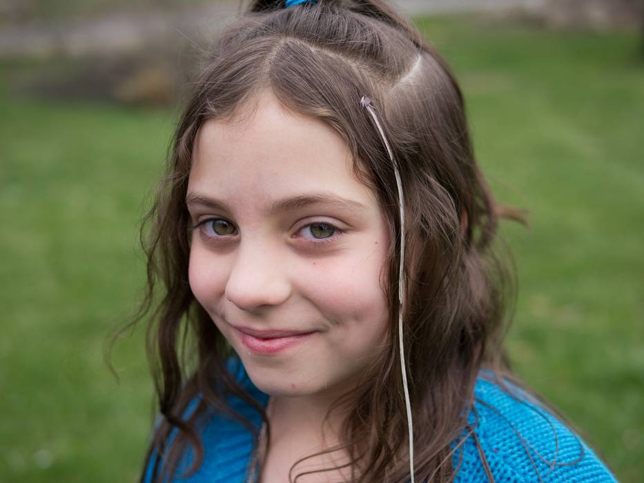 Miranda with feather in hair.<br />April 8, 2012 - Easter dinner at Paul and Norma's in Tewksbury, Massachusetts.