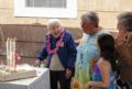 Marie about to blow out the candles with daughters Norma and Joyce and greatgranddaughter Miranda watching.