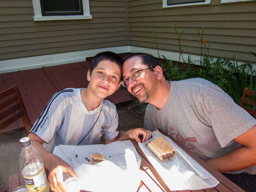 Gudjn and Eric munching on steak subs from the downtown pizzeria.<br />June 15, 2012 - Merrimac, Massachusetts.