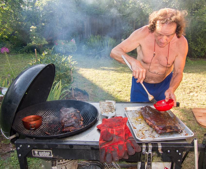 Paul grilling and preparing to grill some more ribs.<br />July 25, 2012 - At Marie's in Lawrence, Massachusetts.