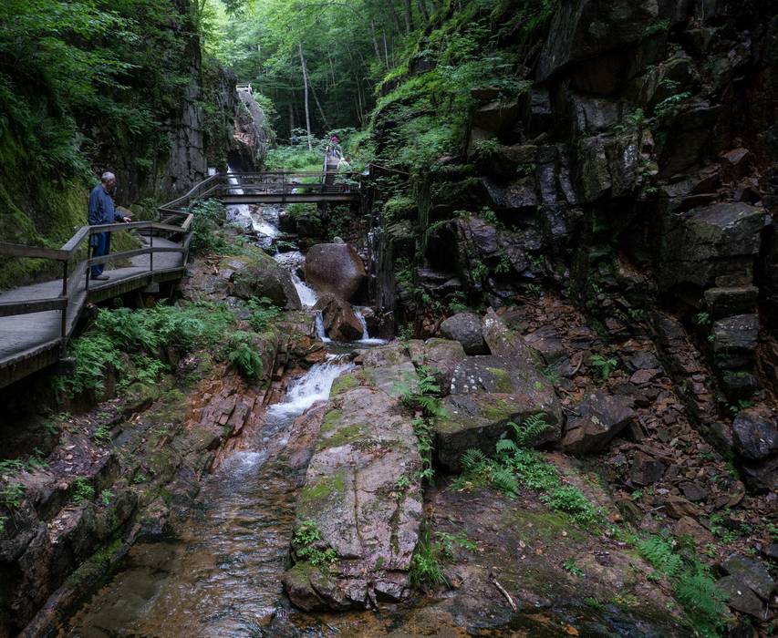 Ronnie in the Gorge.<br />The sign on the bridge says 'Avalanche Falls'.<br />July 26, 2012 - At The Flume in Franconia Notch, New Hampshire.