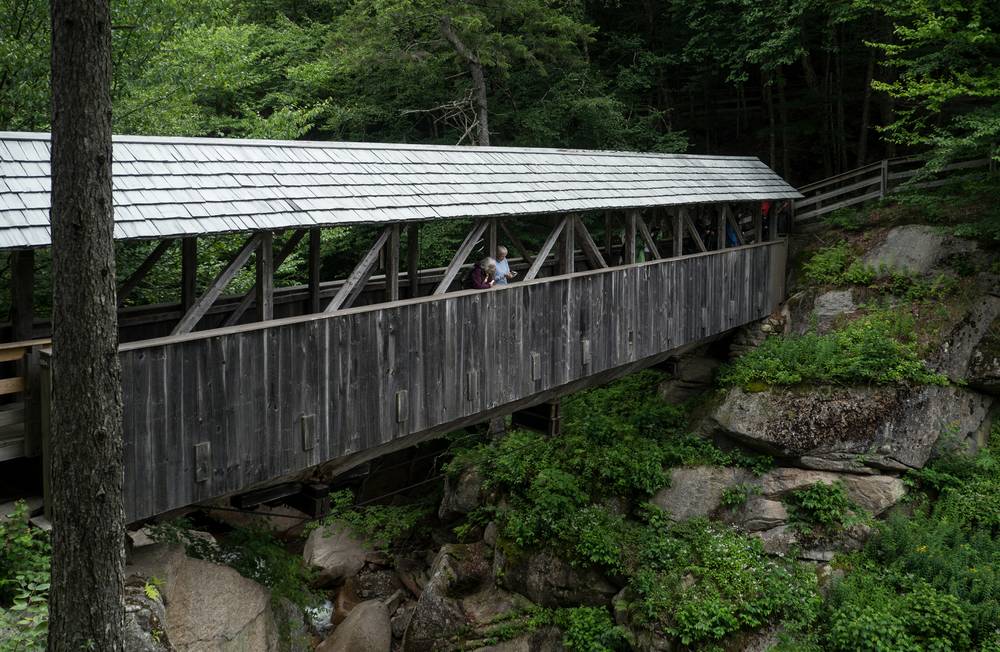 Joyce and Baiba on the covered bridge.<br />July 26, 2012 - At The Flume in Franconia Notch, New Hampshire.