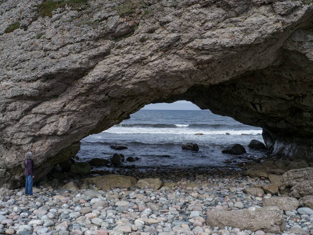 Joyce admiring one of the arches.<br />July 8, 2012 -The Arches Provincial Park, Portland Creek, Newfoundland, Canada