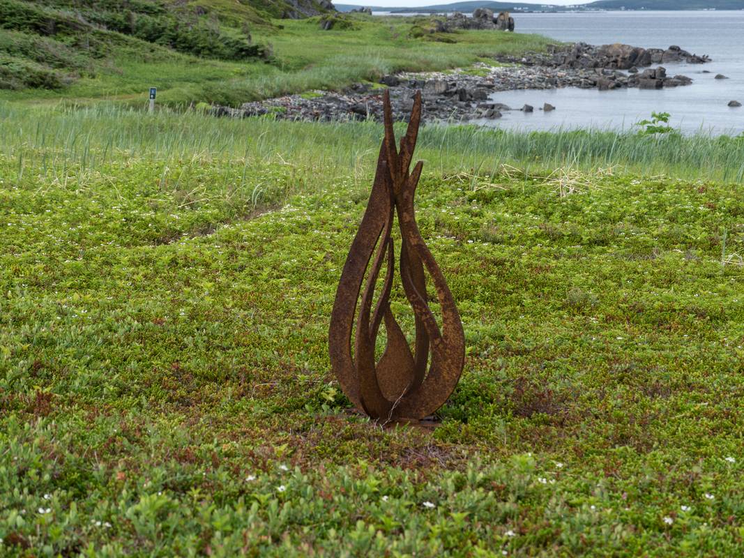 Sculpture atop a native American Indian fire pit.<br />July 9, 2012 - L'Anse aux Meadows National Historic Site, Newfoundland, Canada.