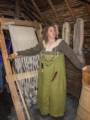 One of the Viking madens at the loom in the longhouse.<br />July 9, 2012 - L'Anse aux Meadows National Historic Site, Newfoundland, Canada.