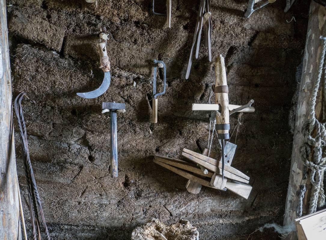 Tools hanging on the sod wall.<br />July 9, 2012 - L'Anse aux Meadows National Historic Site, Newfoundland, Canada.