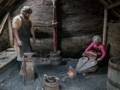Joyce apprenticing with the Norse blacksmith.<br />July 11, 2012 - L'Anse aux Meadows National Historic Site, Newfoundland, Canada.