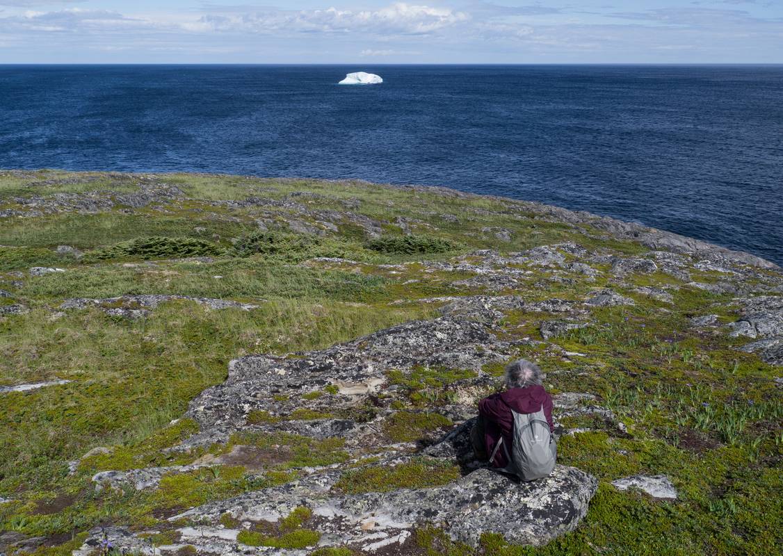 Joyce looking at the little iceberg.<br />July 11, 2012 - Great Brehat, Newfoundland, Canada.