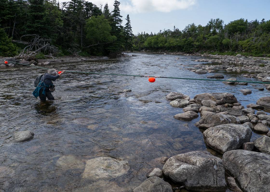 Joyce crossing Western Brook.<br />July 13, 2012 - Western Brook Pond area, Gros Morne National Park, Newfoundland, Canada.