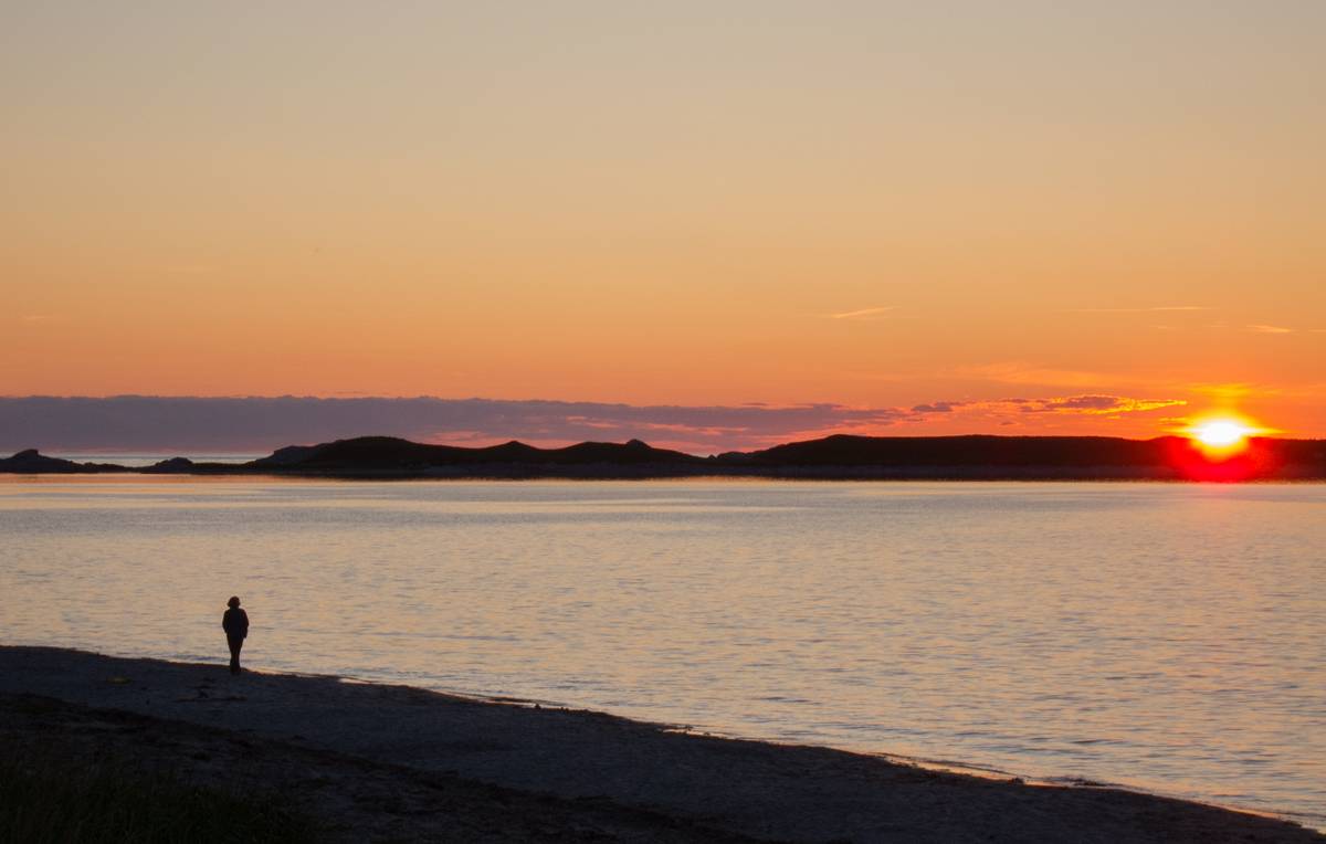 Joyce enjoying the sunset.<br />Beach at Shallow Bay, Gros Morne National Park.<br />June 14, 2012 - Just north of Cow Head, Newfoundland, Canada.