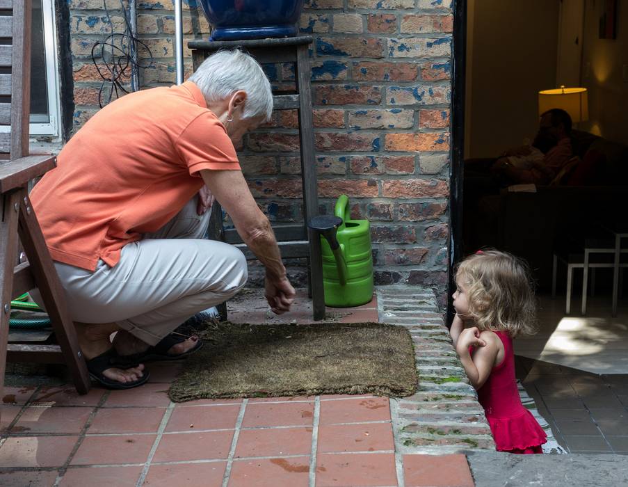 Baiba showing Alina a snail.<br />August 3, 2012 - Apartment on Cumberland Street, Brooklyn, New York.