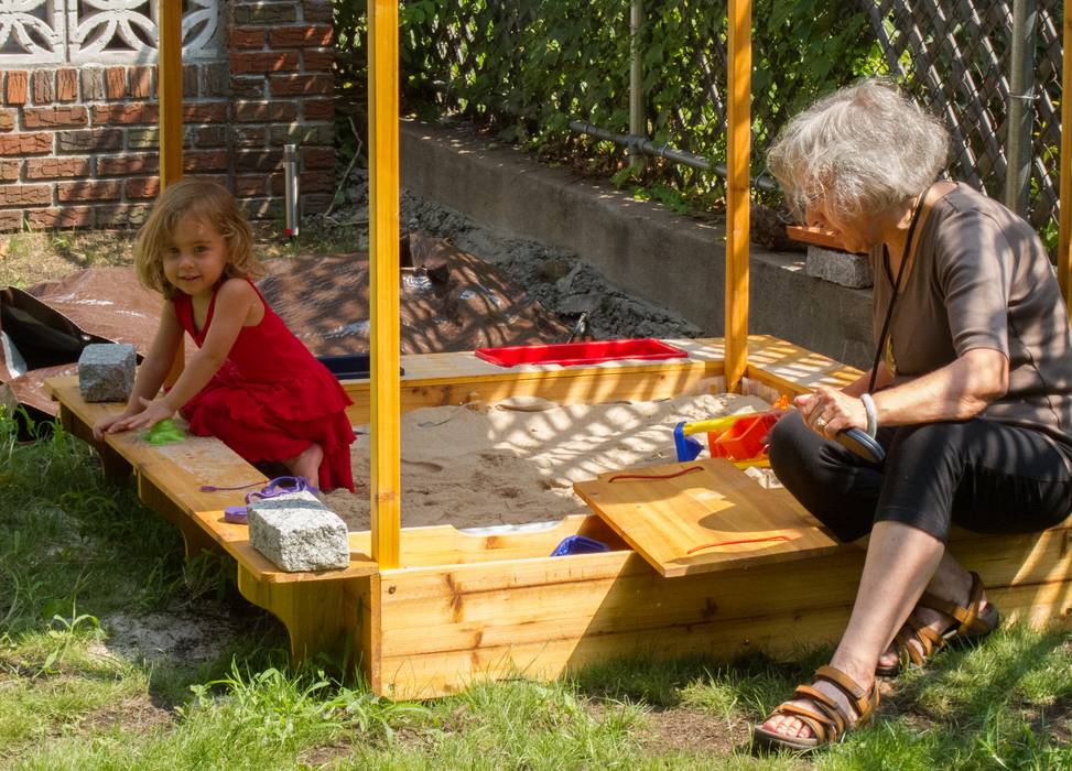 Alina and Joyce playing in the sandbox.<br />August 3, 2012 - At Julian and Gisela's in Brooklyn, New York.