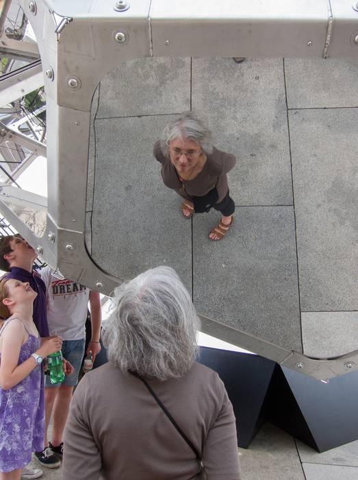 Joyce reflected in one of the mirrored panels of 'Cloud City'.<br />August 3, 2012 - Metropolitan Museum of Art, Manhattan, New York.