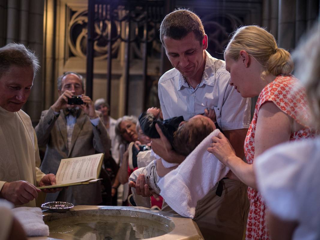 Edgar, who was not too happy with the ceremony, and godparents Meinhard and Cynthia.<br />Edgar's and Benjamin's Christening<br />August 5, 2012 - Queen of All Saints Church, Brooklyn, New York.