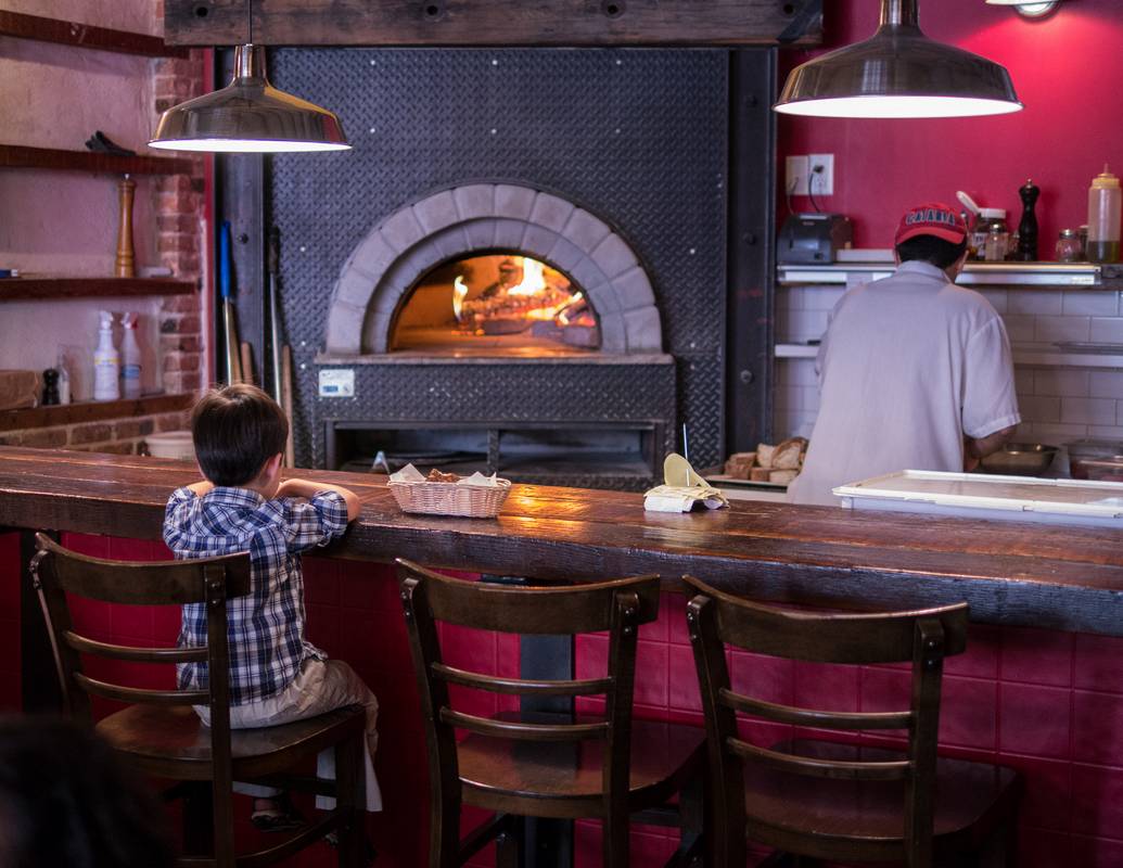 The boy sat there for a long time mesmerized by the fire in the oven.<br />After Edgar's and Benjamin's Christening.<br />August 5, 2012 - Anima Italian Bistro in Brooklyn, New York.